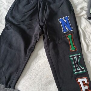 Nike Black Joggers with Colorful Lettering
